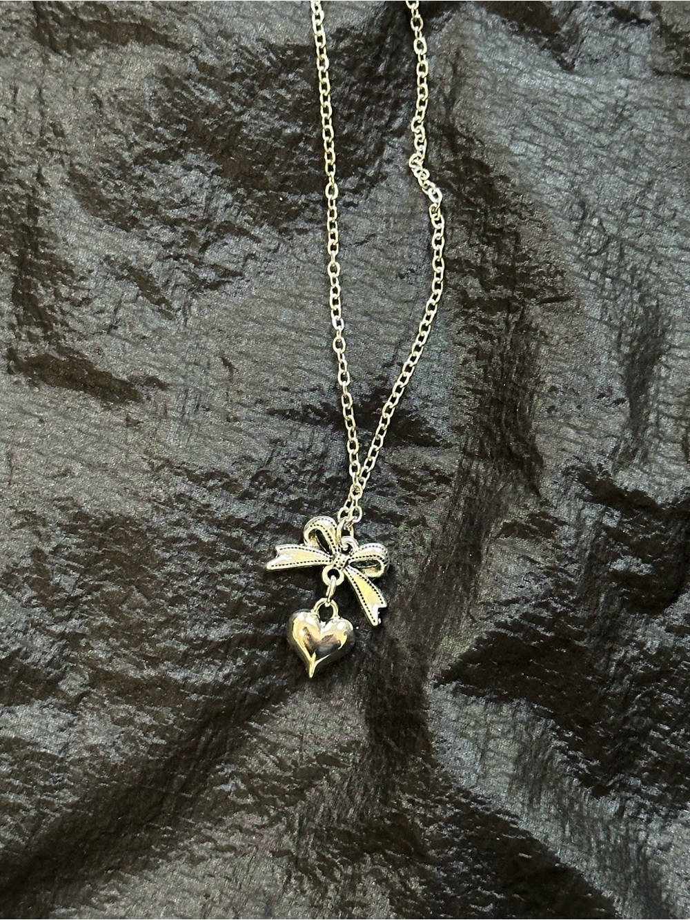 Dolls Kill Silver Bow with Dangling Heart Necklace